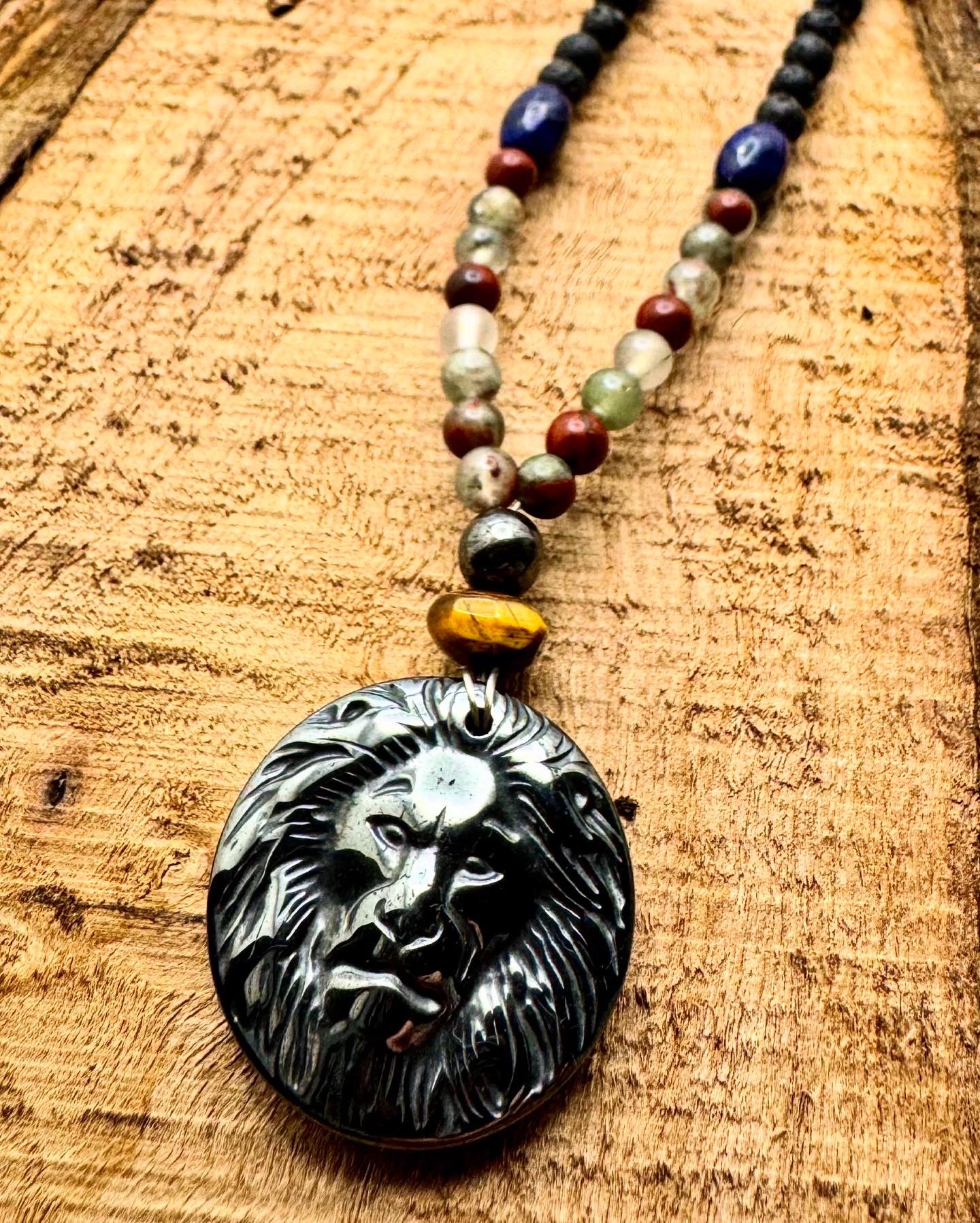 Guardian of Strength – Hematite Lion Necklace with African Blood Agate, Lapis Lazuli, Lava Stone, Shell & Wood