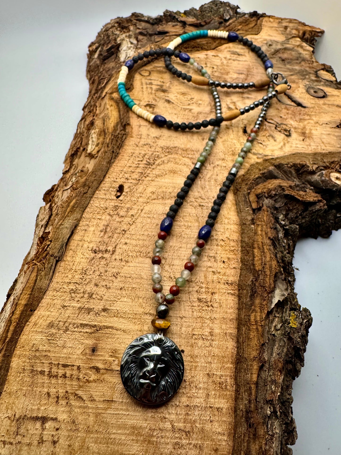 Guardian of Strength – Hematite Lion Necklace with African Blood Agate, Lapis Lazuli, Lava Stone, Shell & Wood